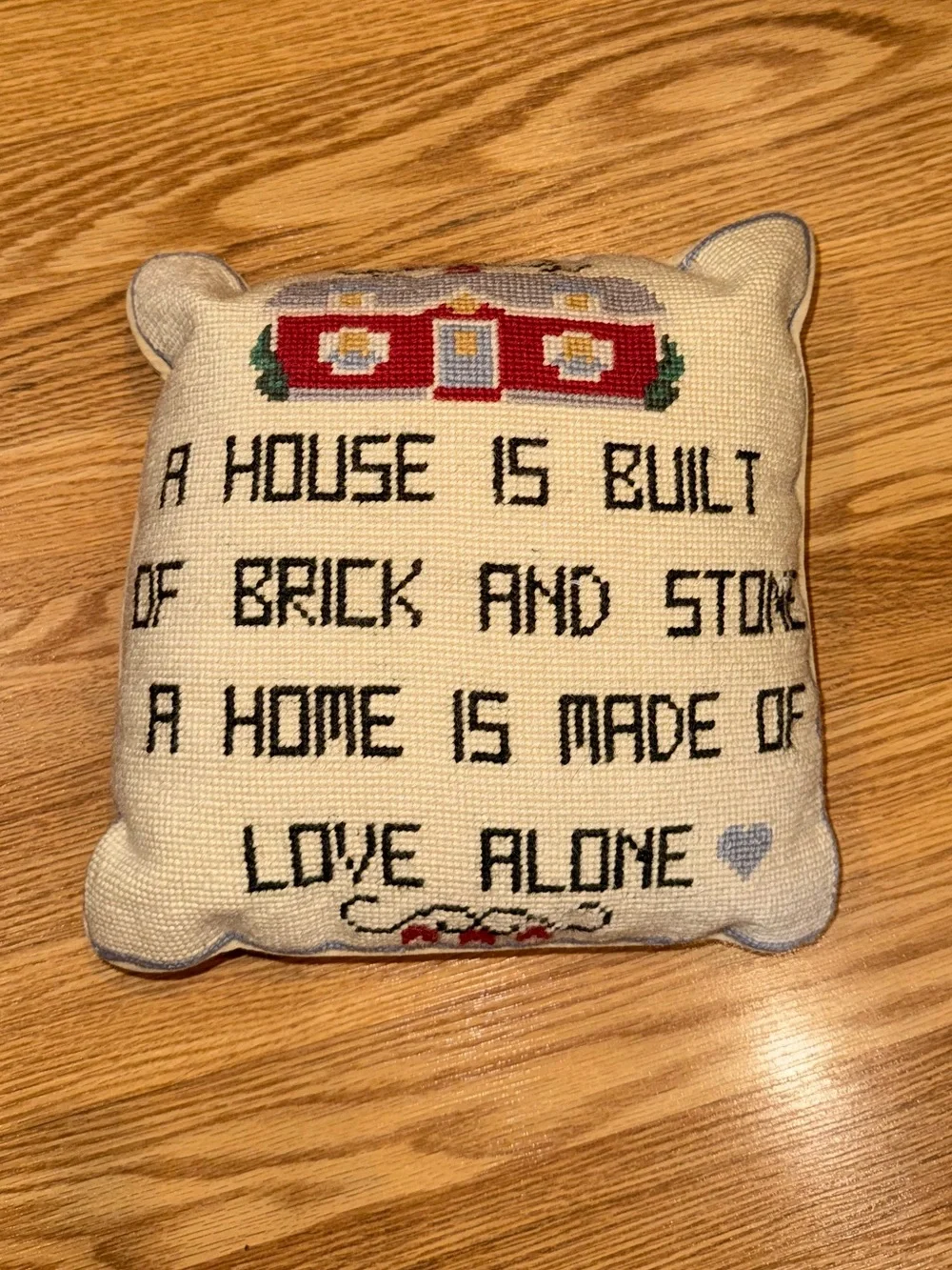 Velvet backed Needlepoint Pillow A House is Built of Brick and Stone‎
